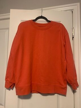 Lululemon sweatshirt in Bright Coral, Sz Small, GUC, small pin hole on shoulder